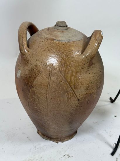 Jug and amphora presented on a tripod metal...