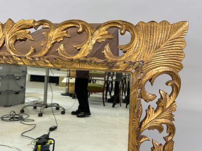 Mirror in gilded wood, with openwork and...