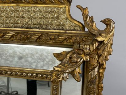 Wood and gilded stucco glazed mirror decorated...