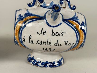 Two polychrome ceramic pourers marked 