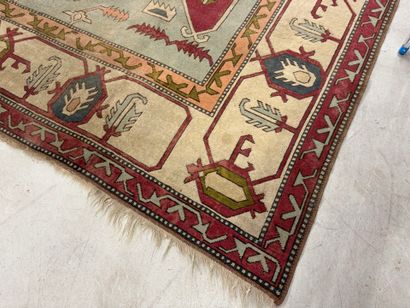 Large hand-knotted wool rug with stylized...