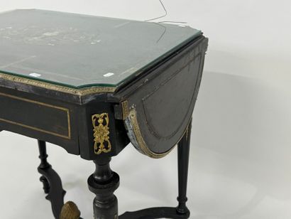 Middle table in blackened wood, opening with...