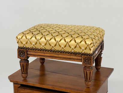 Molded wood footrest, upholstered in yellow...