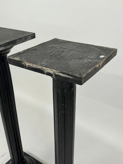 Two blackened wood saddles, fluted shaft,...