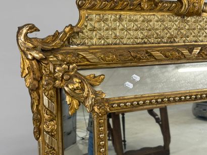 Wood and gilded stucco glazed mirror decorated...