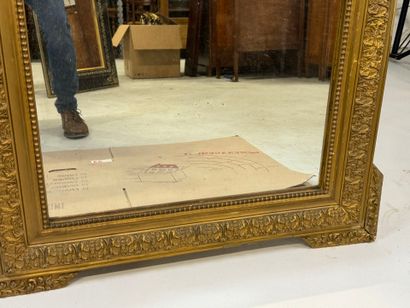 Wood and gilded stucco mirror decorated with...