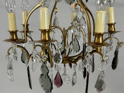 Brass chandelier with eight lights and crystal...
