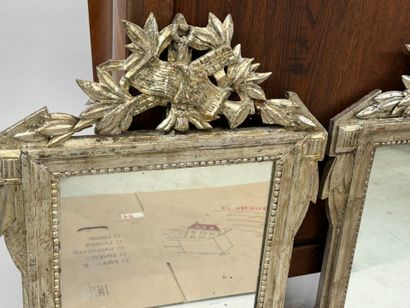 Pair of carved wood and silver-plated mirrors...