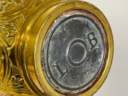 LOB.
Oil lamp in repoussé brass, mounted...