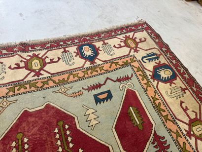 Large hand-knotted wool rug with stylized...