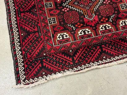 Hand-knotted wool rug with stylized motifs...