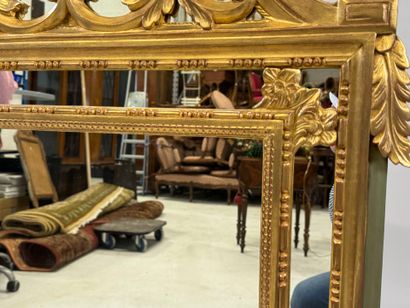 Gilded wood mirror with foliate decoration,...