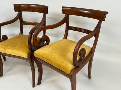 Trois fauteuils en acajou mouluré, les accotoirs...