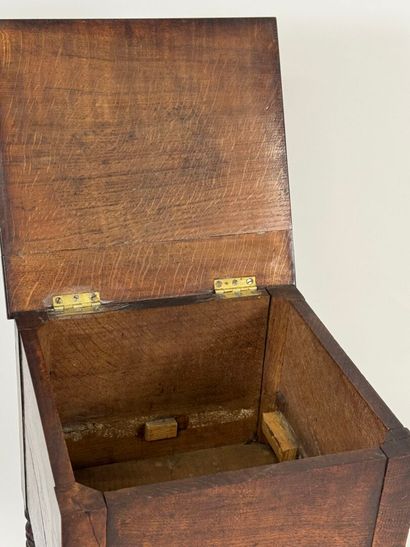 Turned wood bedside table opening with a...