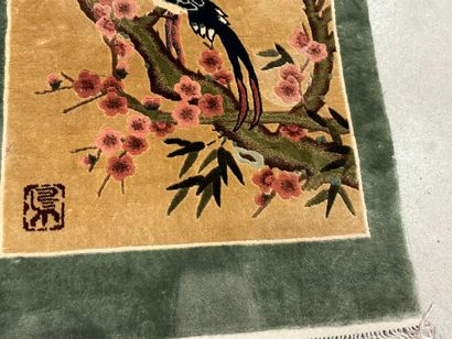 Small silk carpet with polychrome decoration...
