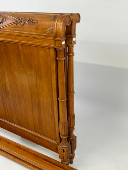 Carved wood bed decorated with basins and...