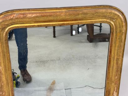 Wood and gilded stucco mirror, the upper...