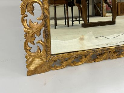 Mirror in gilded wood, with openwork and...