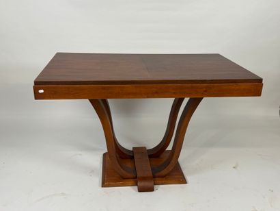 Small wooden dining table with basin base.
74...
