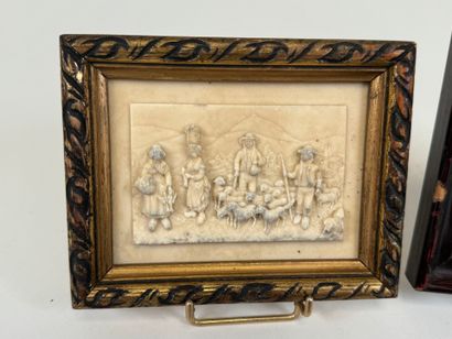 Two petrified limestone plaques decorated...