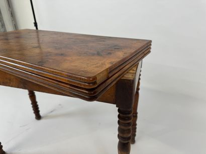 Turned wood game table with green fabric...