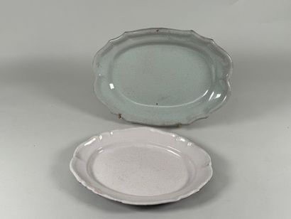 Two black butt plates, scalloped edge.
38...