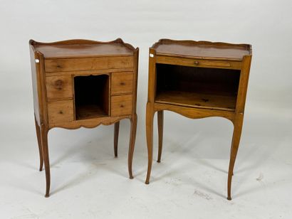 Two wooden bedside tables, one opening with...