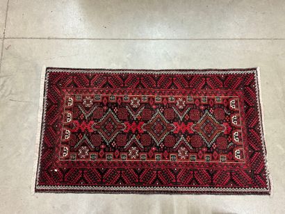 Hand-knotted wool rug with stylized motifs...