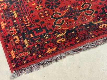 Hand-knotted wool rug with stylized motifs...