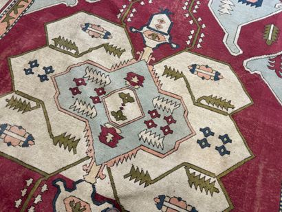 Large hand-knotted wool rug with stylized...