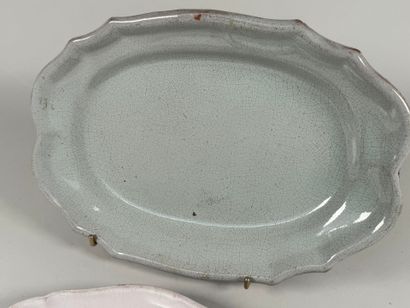 Two black butt plates, scalloped edge.
38...