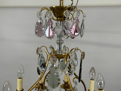 Brass chandelier with eight lights and crystal...