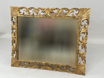 Mirror in gilded wood, with openwork and...