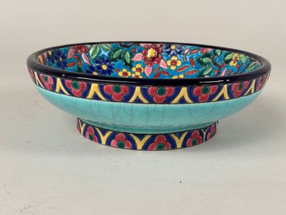 Émaux de LONGWY.
Coupe talon en faïence polychrome...