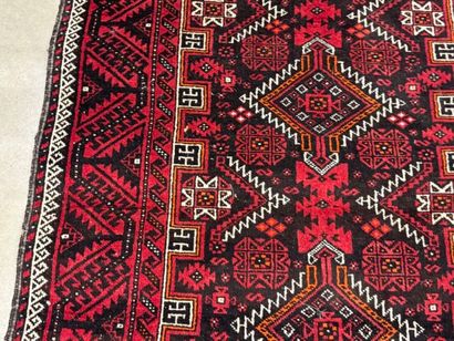 Hand-knotted wool rug with stylized motifs...