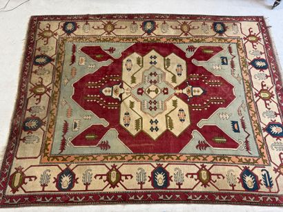 Large hand-knotted wool rug with stylized...