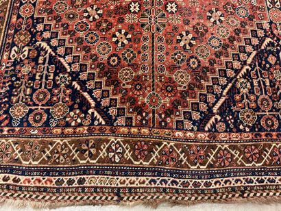 Oriental hand-knotted wool rug with stylized...