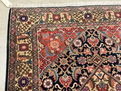 Oriental rug in knotted wool decorated with...