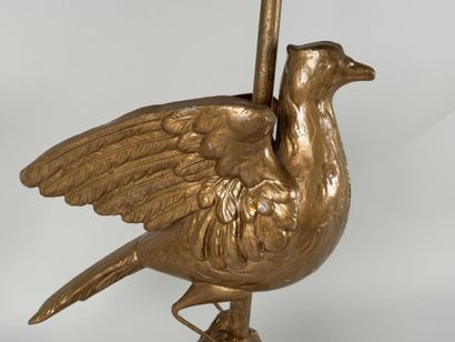 Gilded metal lamp base featuring a bird resting...