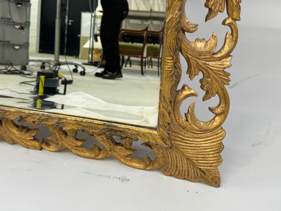 Mirror in gilded wood, with openwork and...