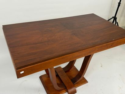 Small wooden dining table with basin base.
74...