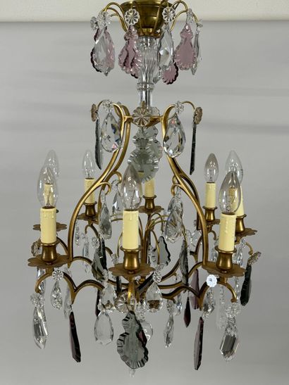 Brass chandelier with eight lights and crystal...