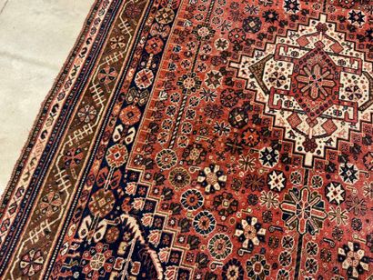 Oriental hand-knotted wool rug with stylized...