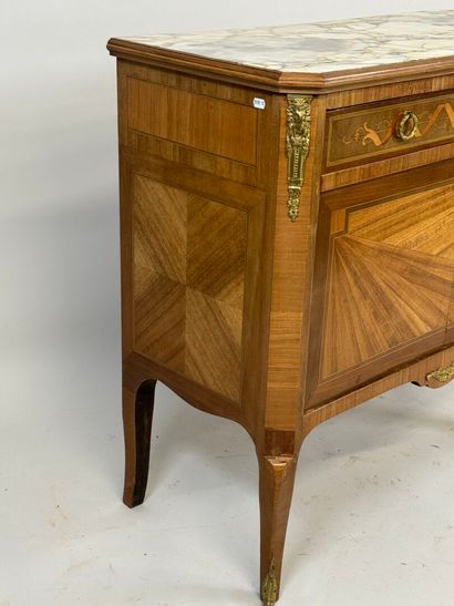 Small inlaid commode opening with two doors...