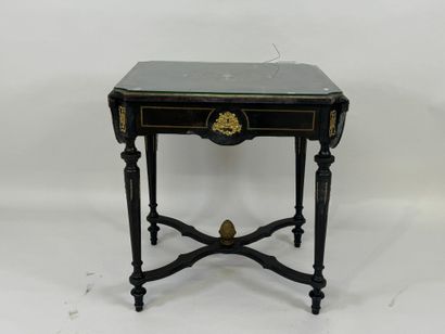 Middle table in blackened wood, opening with...