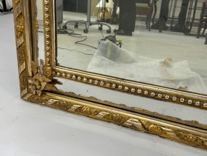 Wood and gilded stucco glazed mirror decorated...