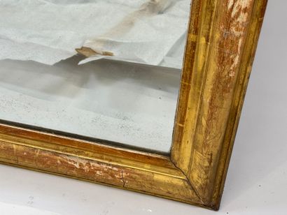 Wood and gilded stucco mirror, the upper...