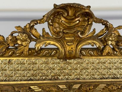 Wood and gilded stucco glazed mirror decorated...