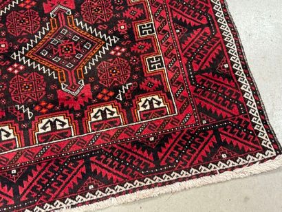 Hand-knotted wool rug with stylized motifs...