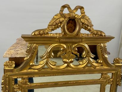 Gilded wood mirror with foliate decoration,...
